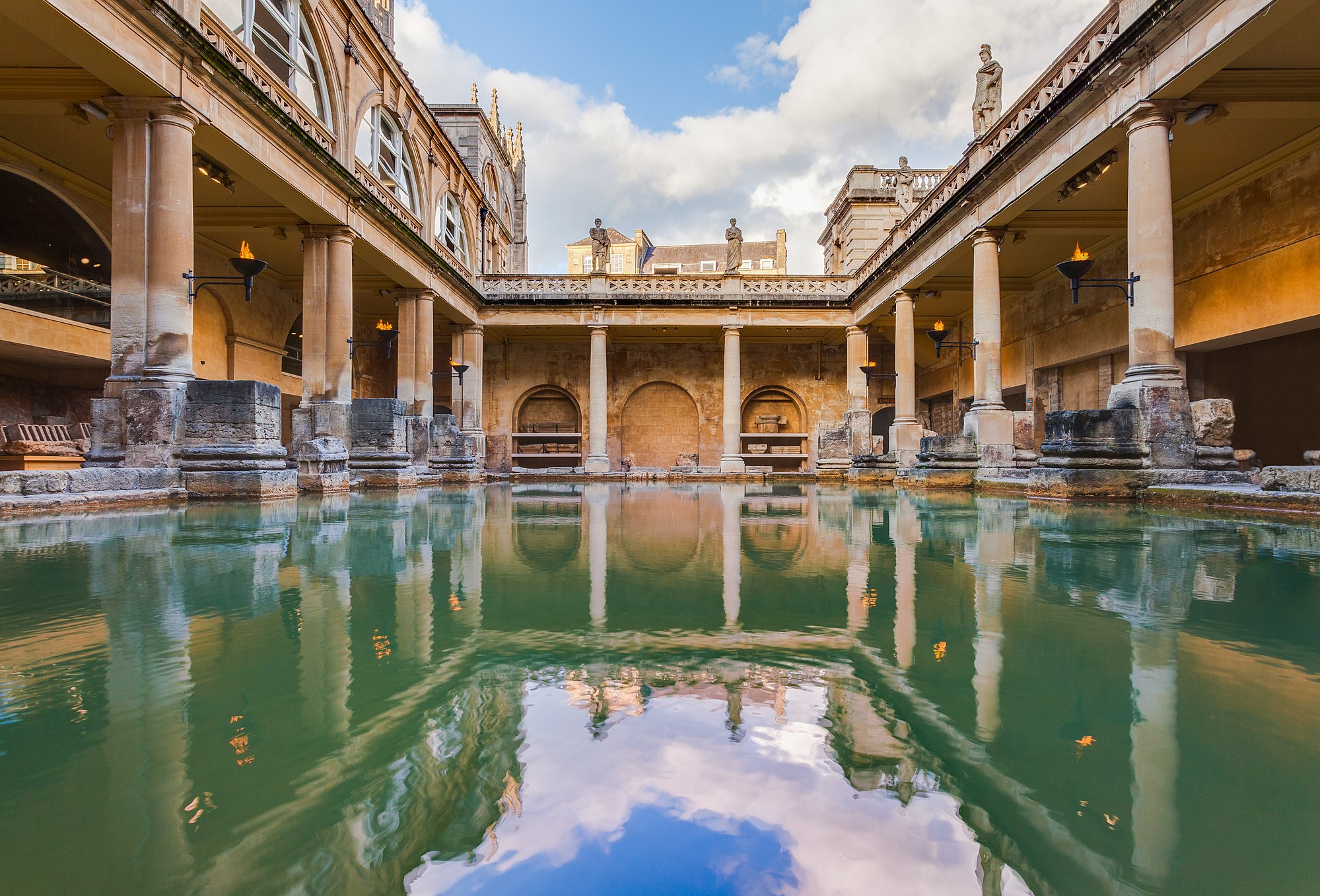 View of the Great Bath, part of the Roman Baths complex, a site of historical interest in the city of Bath, England. The baths, based on the local hot springs, were built during the Roman occupation of Britain and has become a major touristic site.
