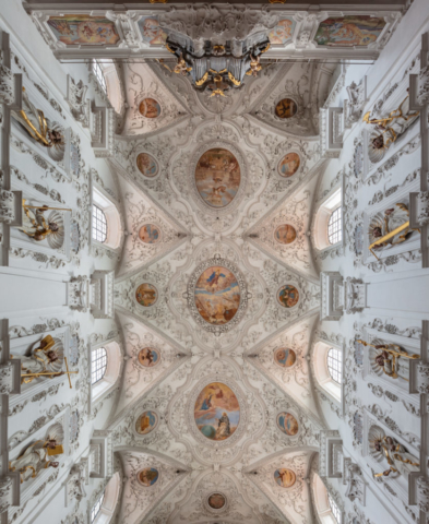 Pipe organ, apostle statues and ceiling of the Baroque church of the Assumption of Mary, Kirchhaslach, Germany.