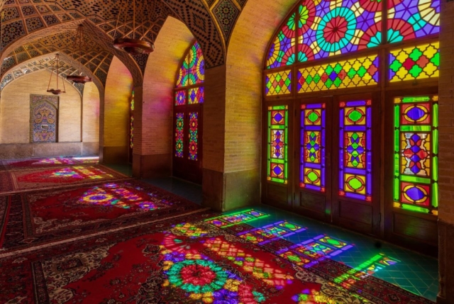 Colored windows seen from the interior of the Nasir-ol-Molk Mosque, also known as the Pink Mosque, a traditional mosque located in Shiraz district of Gouwd-e-Arabān, Iran. The mosque was built from 1876 to 1888, by the order of Mirzā Hasan Ali (Nasir ol Molk), a Qajar ruler.