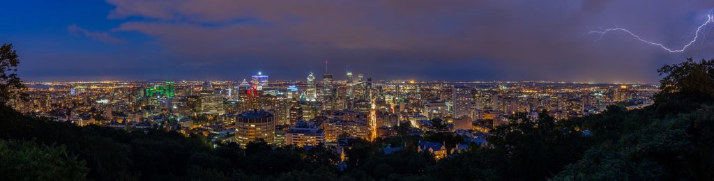 Panoramic view of the city of Montreal in a stormy day from Mount Royal, Quebec, Canada.