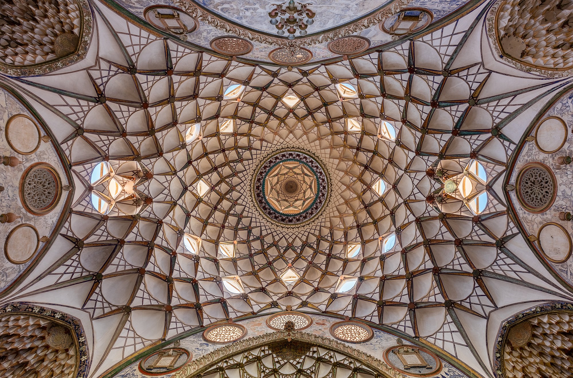 View of the rich ceiling of the interior courtyard of the Borujerdi House, a historic house located in Kashan, Iran. The house dates from 1857 and was constructed by architect Ustad Ali Maryam for a wealthy merchant as proof of love to his wife.