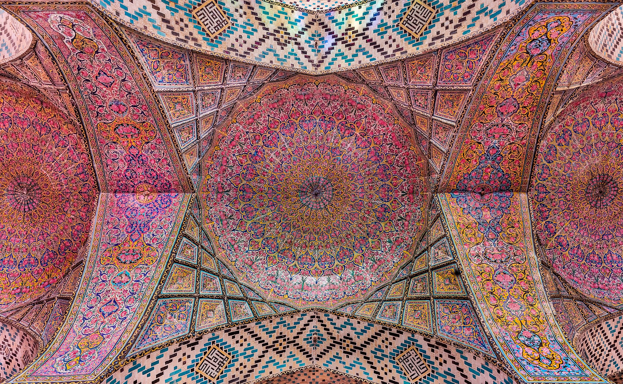 View of the ceiling in the interior of the Nasir-ol-Molk Mosque, also known as the Pink Mosque, is a traditional mosque located in Shiraz district of Gowad-e-Arabān, Iran. The mosque was built from 1876 to 1888, by the order of Mirzā Hasan Ali (Nasir ol Molk), a Qajar ruler.