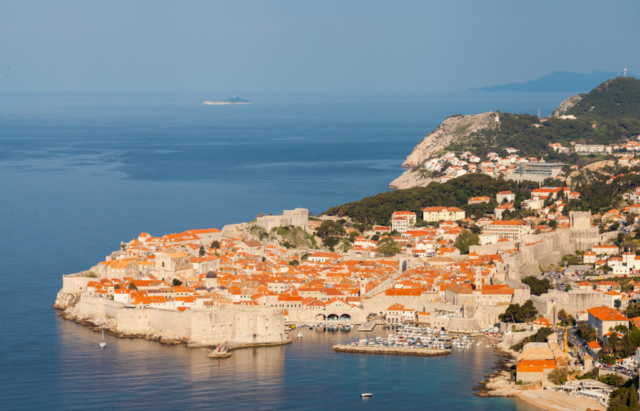 Early morning view of the Old Town of Dubrovnik and its city walls, an UNESCO Heritage Site since 1979. The former Republic of Ragusa was a maritime republic centered on the city of Dubrovnik (Ragusa in Italian and Latin) in Dalmatia (today in southernmost modern Croatia), that existed from 1358 (end of the sovereignty of Venice) to 1808 (conquered by Napoleon's French Empire). It reached its commercial peak in the 15th and the 16th centuries, under the protection of the Ottoman Empire. It had a population of about 30,000 people, of whom 5,000 lived within the city walls.