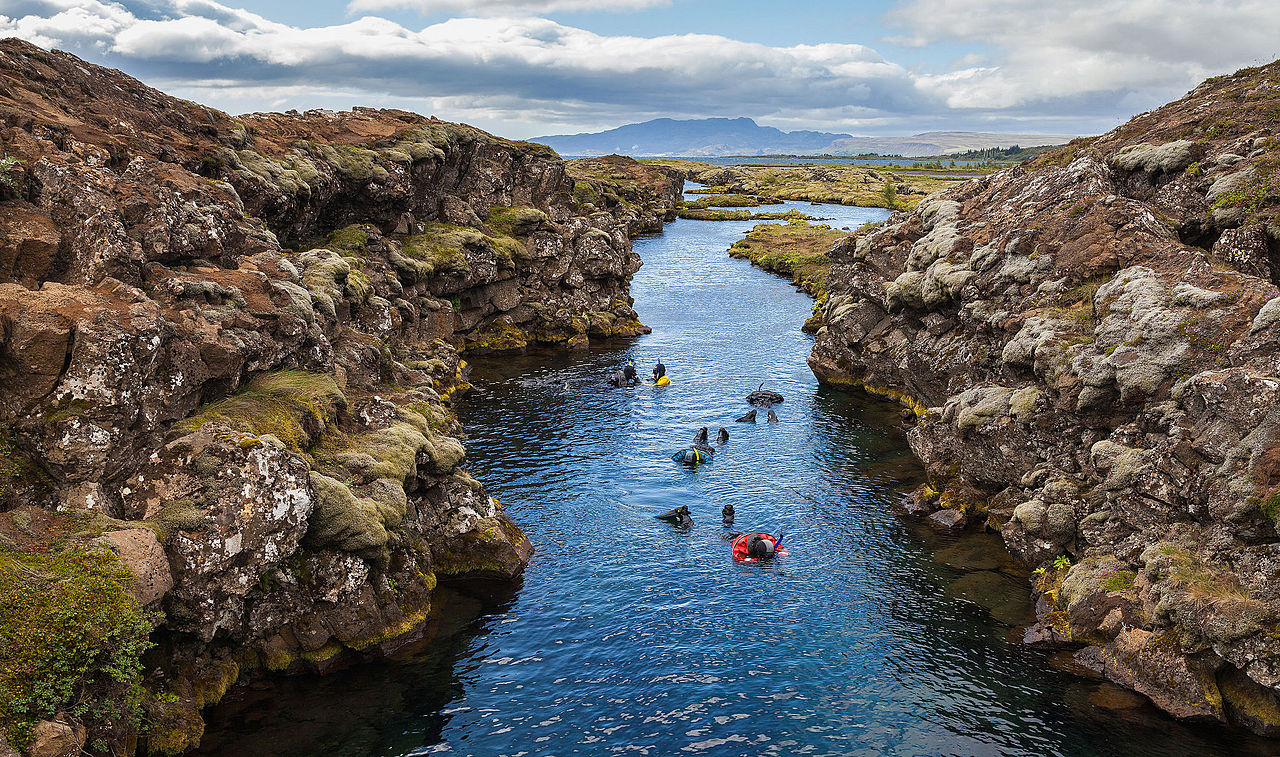 Snorkeling in the Silfra canyon, a rift between the tectonic plates (North American and Eurasian), Þingvellir National Park, Iceland.