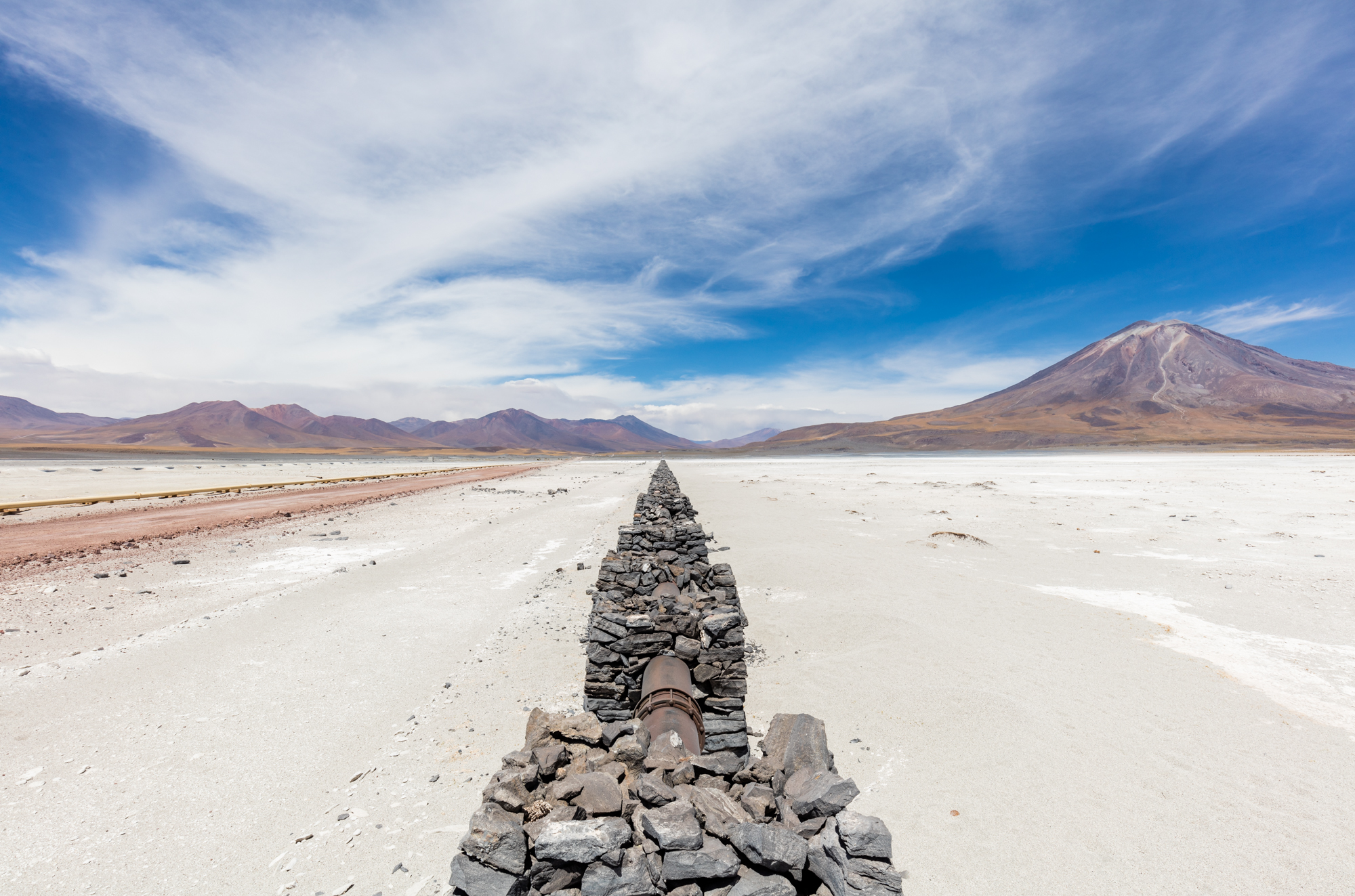 View of a gas pipeline that vanishes in the infinite next to the road B-145, province of El Loa, northern Chile.