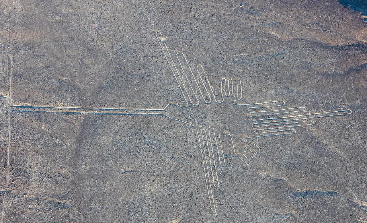 Aerial view of "The Hummingbird", one of the most popular geoglyphs of the Nazca Lines, which are located in the Nazca Desert in southern Peru. The geoglyphs of this UNESCO World Heritage Site (since 1994) are spread over a 80 km (50 mi) plateau between the towns of Nazca and Palpa and are, according to some studies, between 500 B.C. and 500 A.D. old.