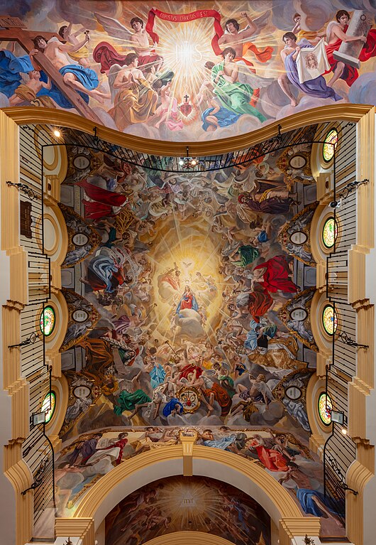 Ceiling of the Oratory of Saint Mary Queen and Mother, Málaga, Spain. The church was constructed in 2008 and is host of the Confraternity of the Sorrows. The paintings in the ceiling, done with acrylic paint, are work of Raúl Berzosa Fernández and were executed in different phases between 2008 and 2014. The 140 square metres (1,500 sq ft) surface is dedicated to the Coronation of the Virgin.