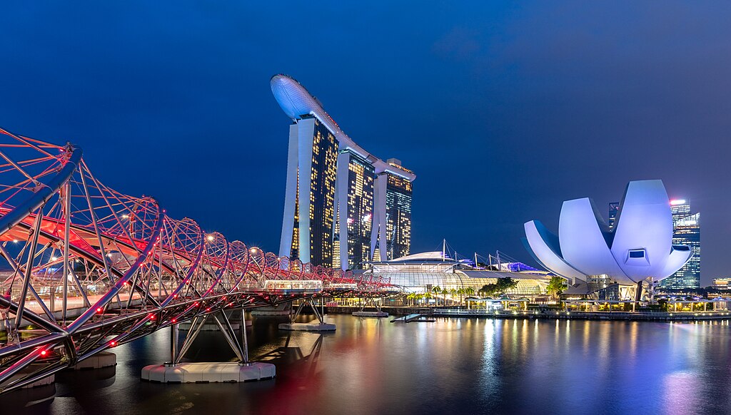 View of the Helix Bridge, the Marina Bay Sands Hotel and the ArtScience Museum during the blue hour, Marina Bay, Singapore.