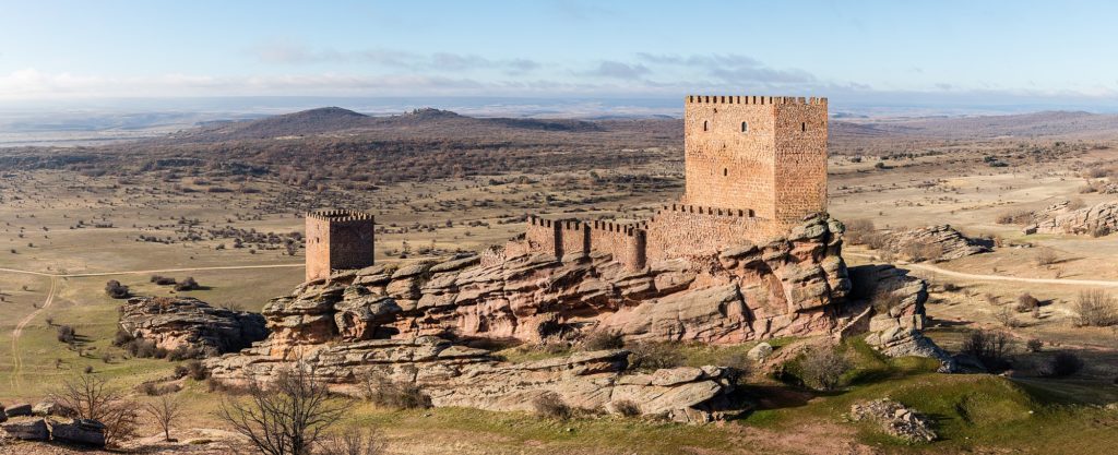View of the Castle of Zafra, Campillo de Dueñas, Guadalajara, Spain. The castle was built in the late 12th or early 13th centuries on a sandstone outcrop and stands on the site of a former Visigothic and Moorish fortification that fell into Christian hands in 1129. It had considerable strategic importance as a virtually impregnable defensive work on the border between Christian and Muslim-ruled territory. The castle was never conquered and was successfully defended against the King of Castile in the 13th century. The successful completion of the Reconquista at the end of the 15th century ended its military significance.